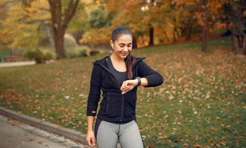 Beautiful girl training. Sports girl in a sportswear. Brunette in a black sweater